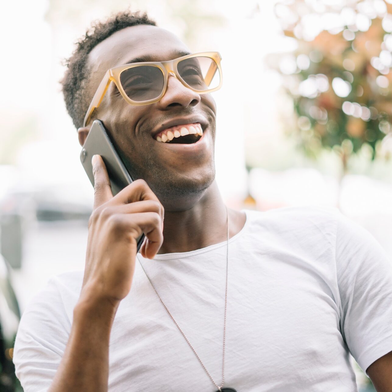 African man using mobile phone.